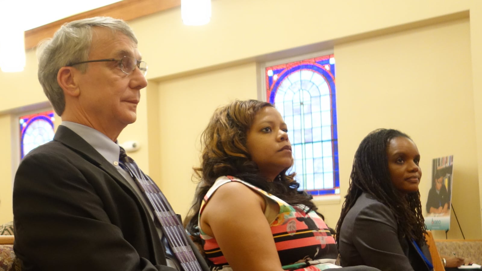 Chris Caldwell (left) and Roshun Austin (right) listen in at community forum for Shelby County Schools candidates on July 14. Many of the same business leaders have donated to their two campaigns, totaling nearly $20,000 each.