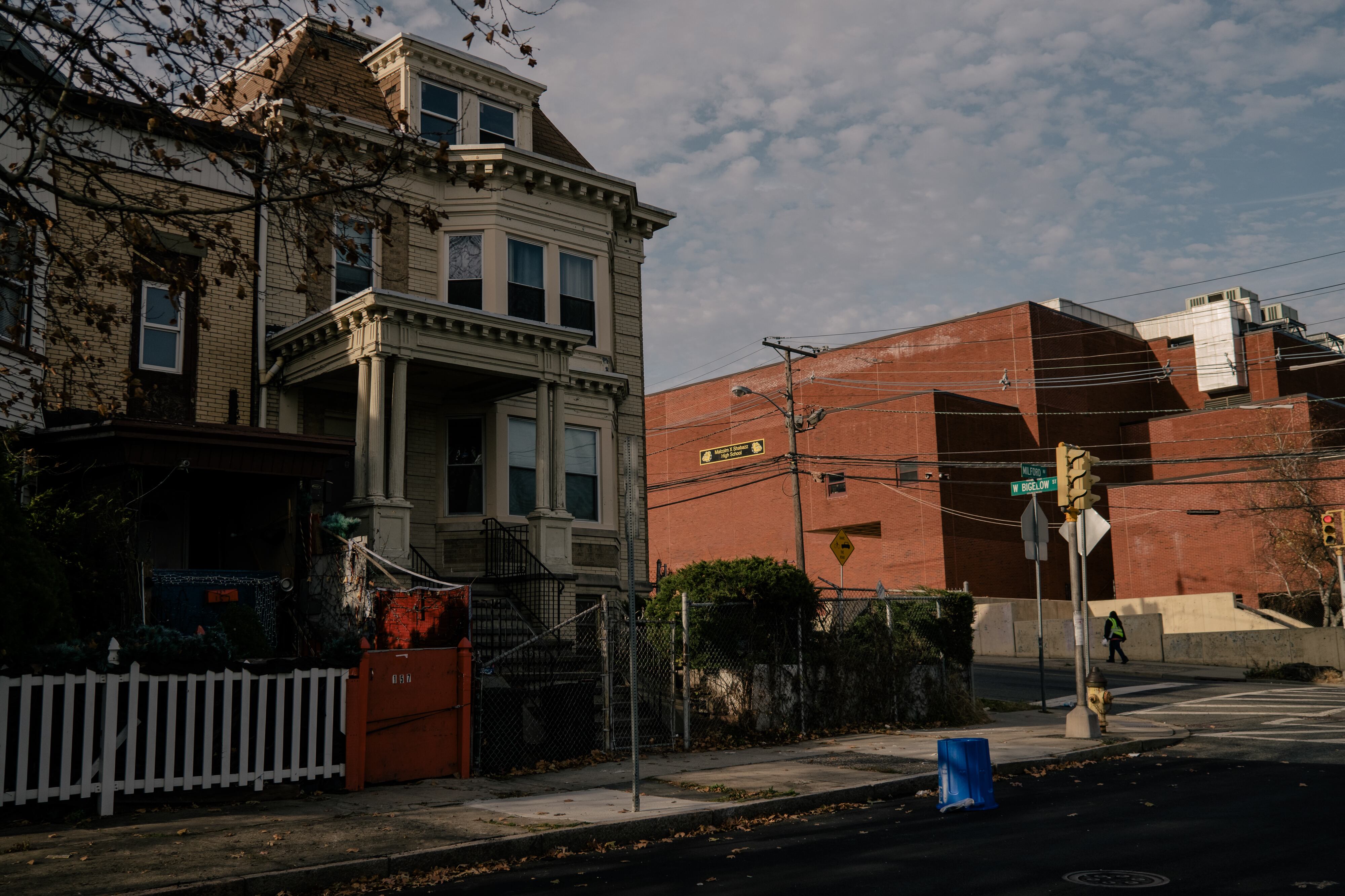 Malcolm X Shabazz High School is seen behind a house at the corner of Milford Avenue and W Bigelow Street in Newark, N.J.