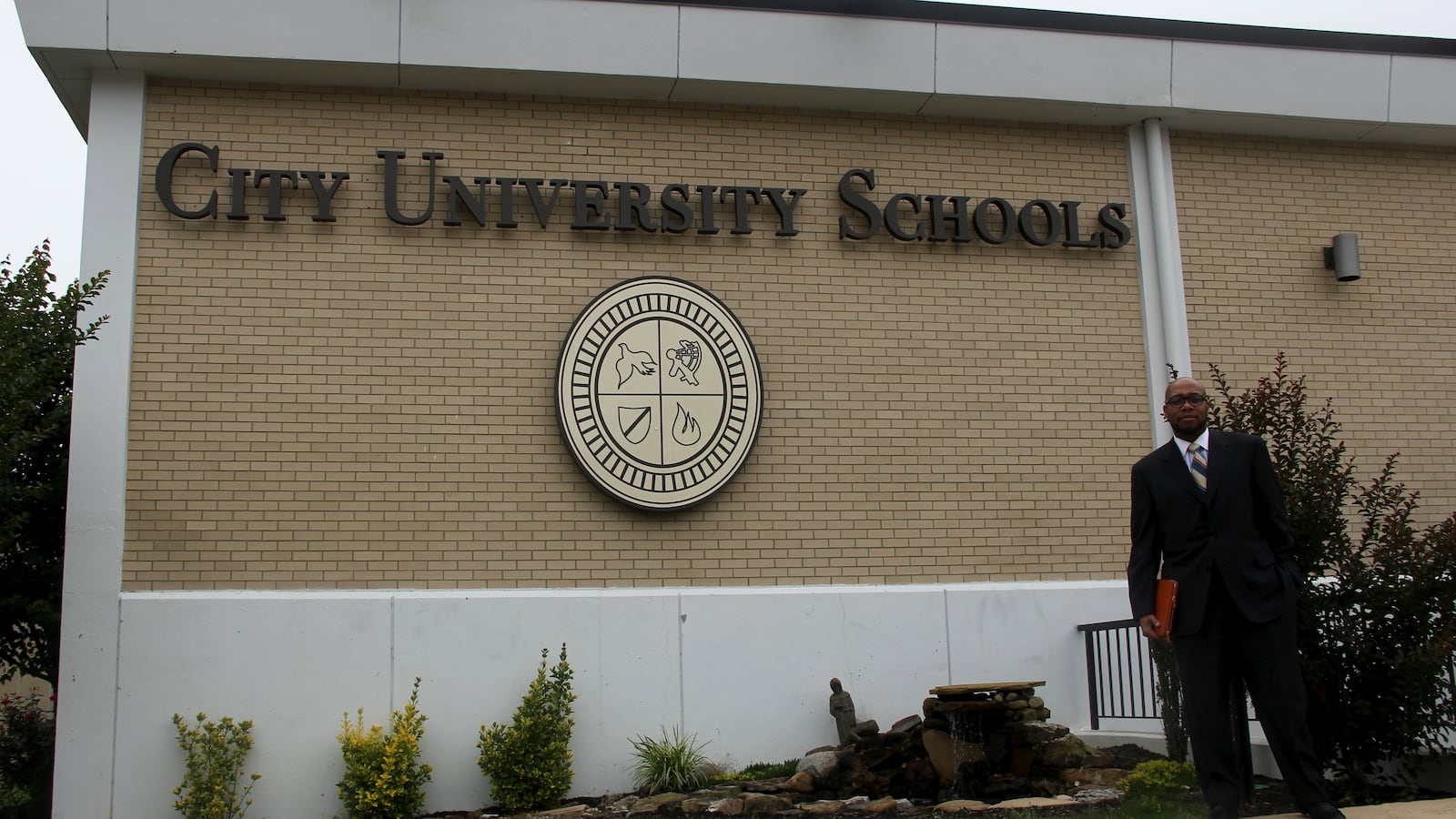 City University Schools founder and chancellor R. Lemoyne Robinson stands outside the school on June 1, 2015.