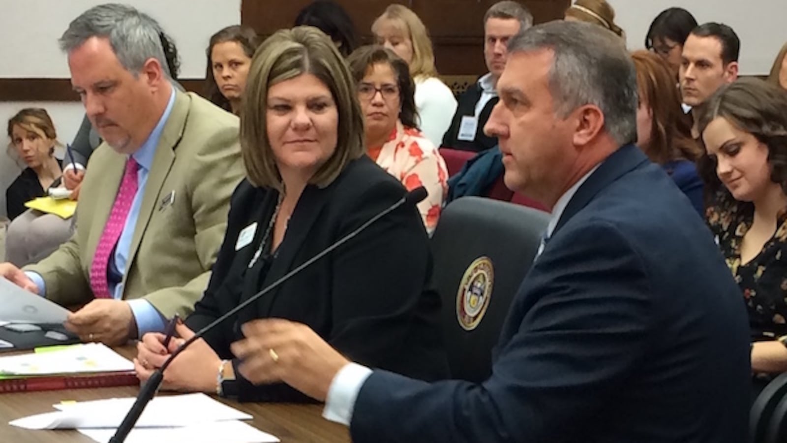 Education Commissioner Richard Crandall (right) talks about teacher recruitment with the Senate Education Committee. Also speaking were Richard Mitchell of the Department of Higher Education (left) and Colleen O’Neil of the Department of Education.