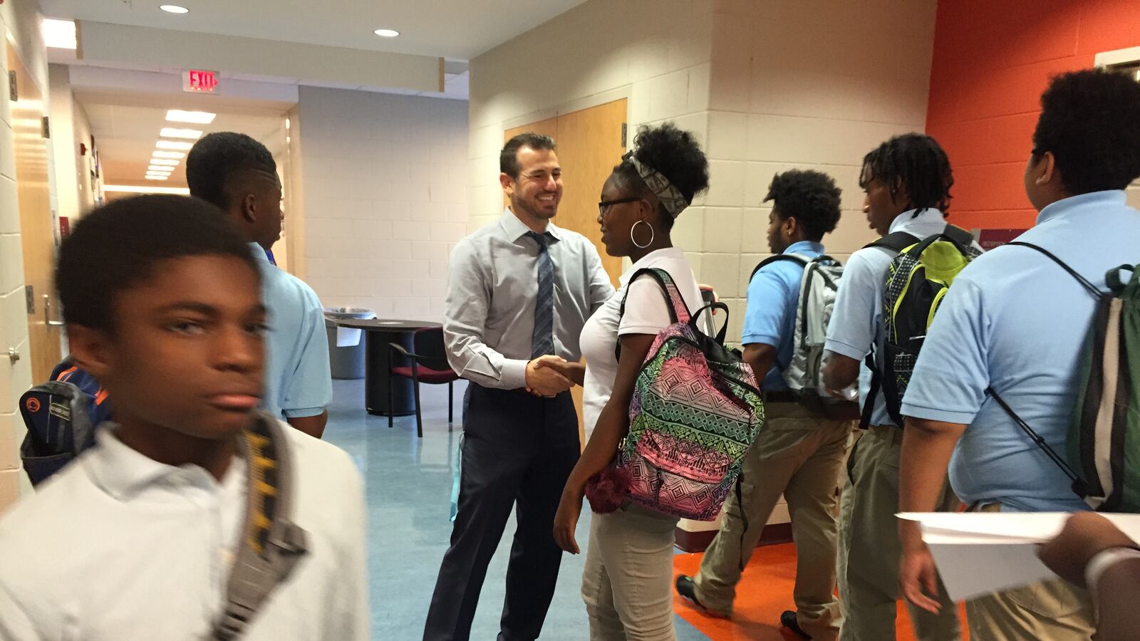 Mumford Academy Principal Nir Saar greets students on the first day of school in 2016.