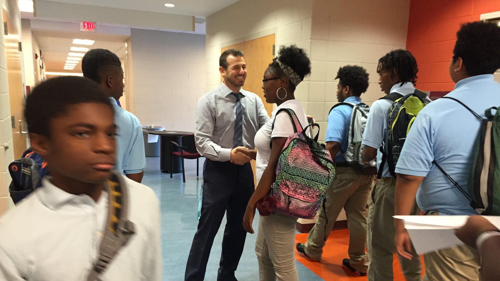 Mumford Academy Principal Nir Saar greets students on the first day of school in 2016.
