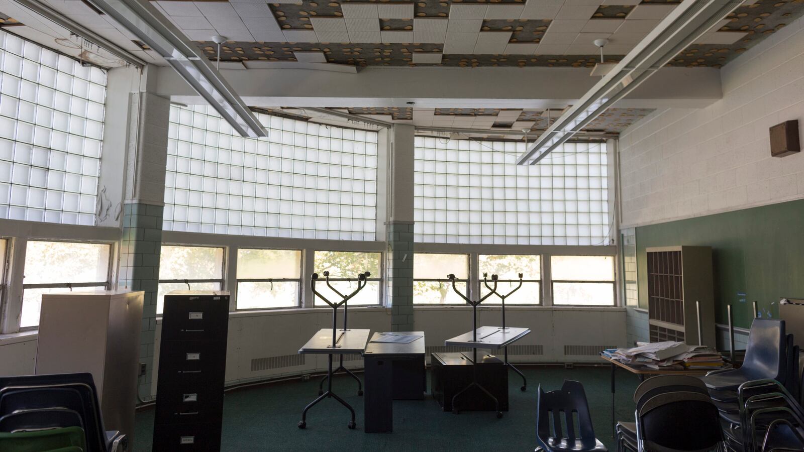 Some classrooms at Cody High School, including this room, can’t be used because of ceiling damage caused by water.