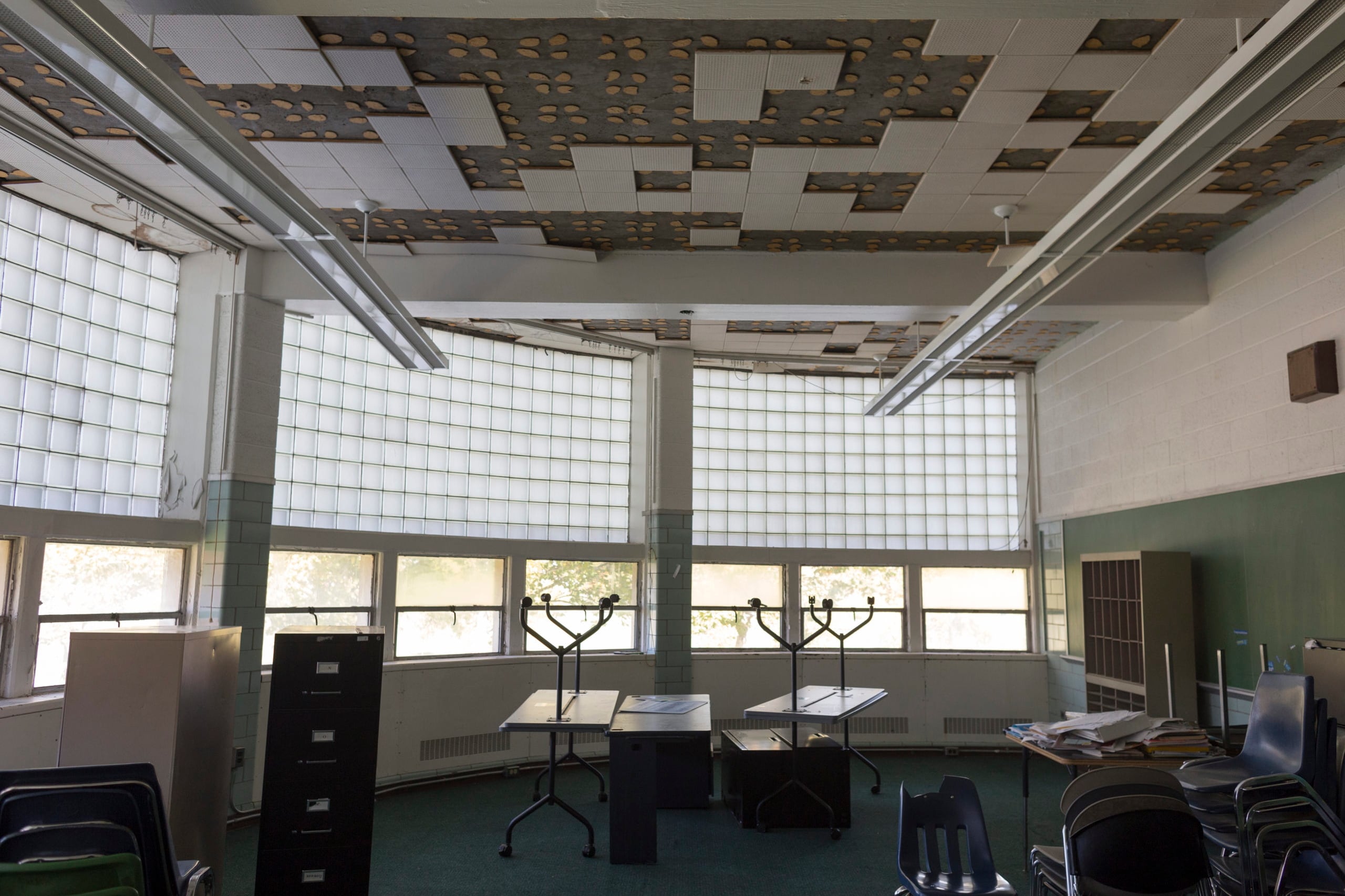 Some classrooms at Cody High School, including this room, can’t be used because of ceiling damage caused by water.