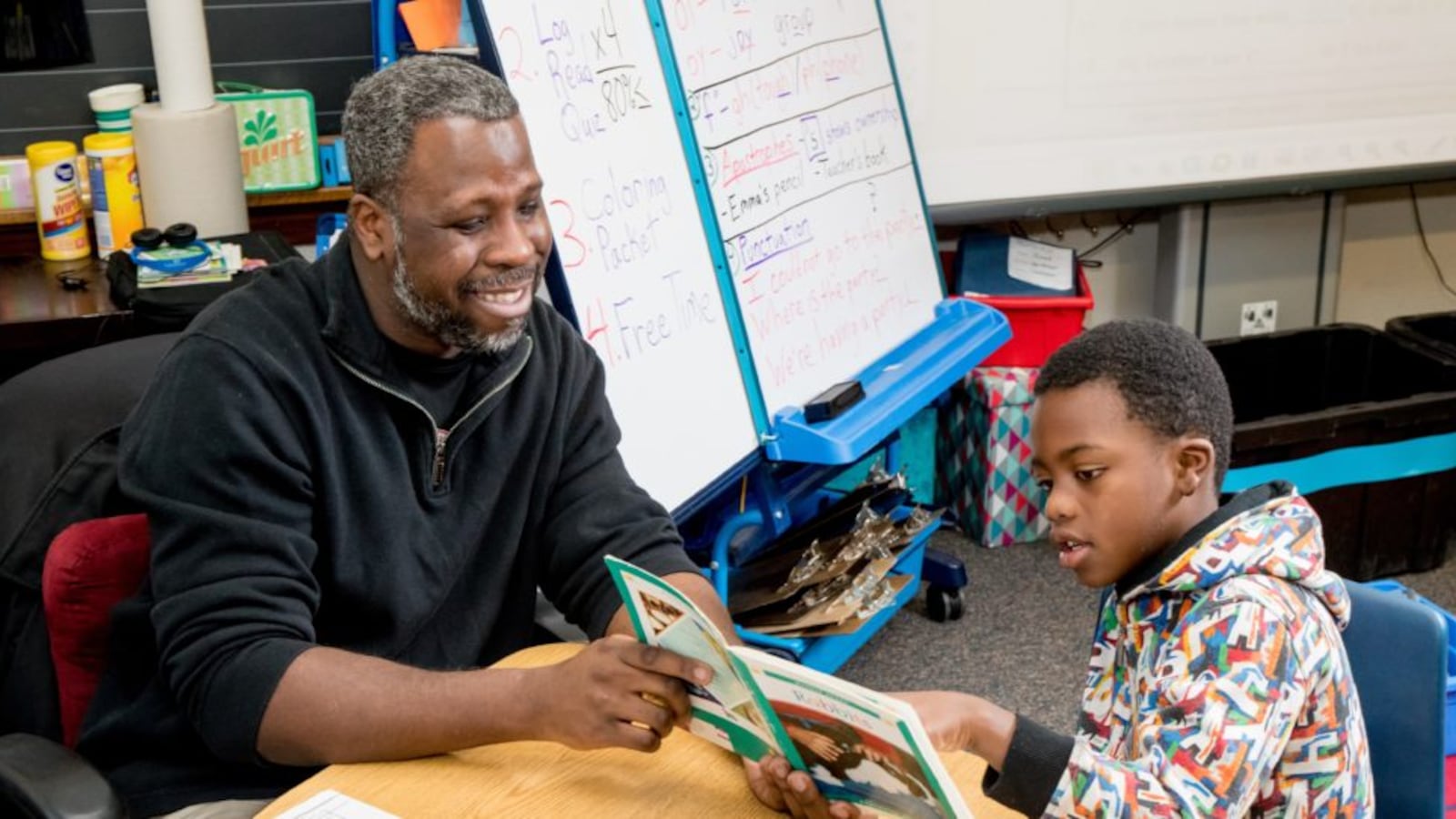 Second-grade literacy teacher Brandon Mason works with a student at Fairview Elementary.