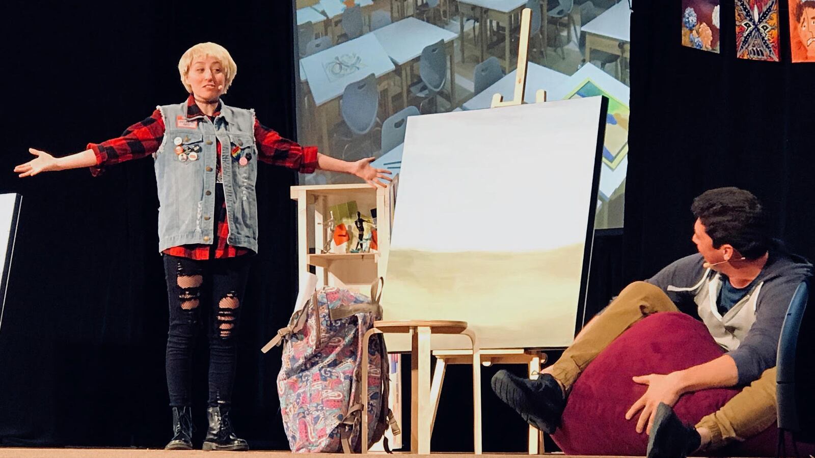 Actors playing Syd and Andre during a recent production of "Ghosted" in the Littleton school district.