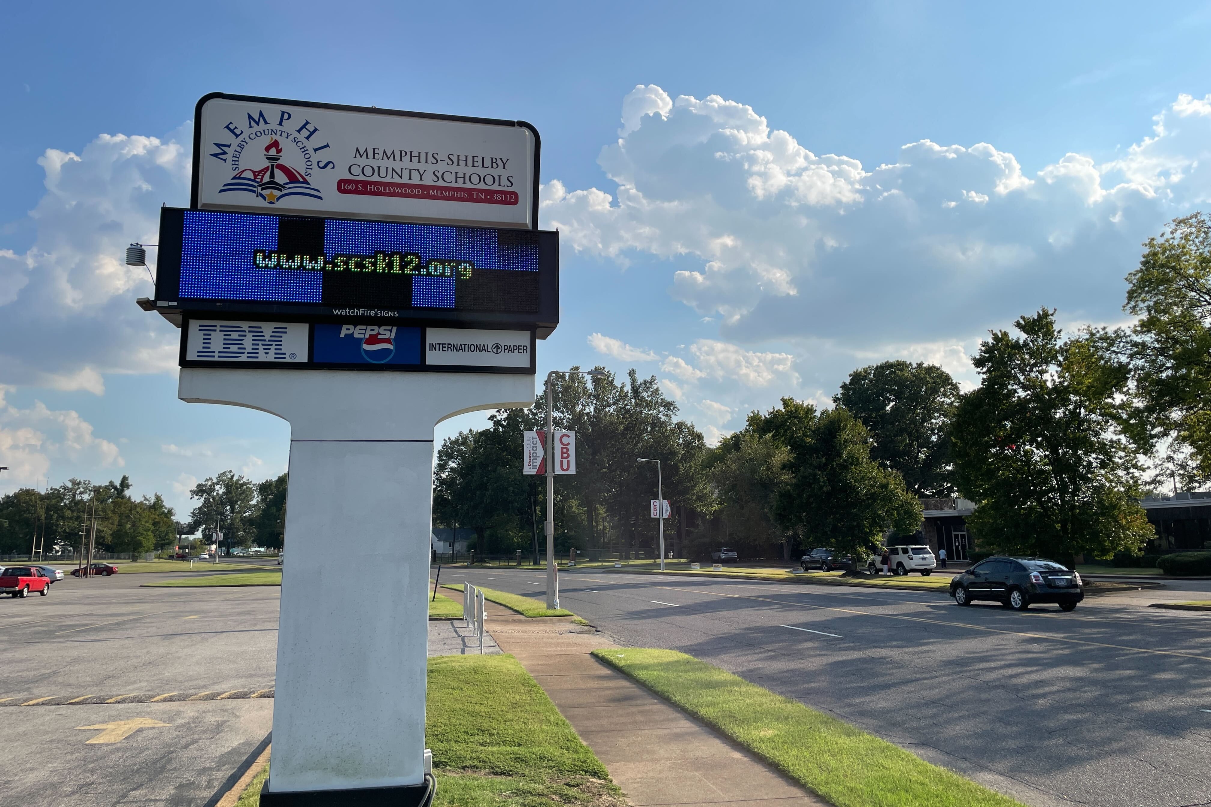 An electronic Memphis-Shelby County Schools sign near the road shows the district’s website www.scsk12.org
