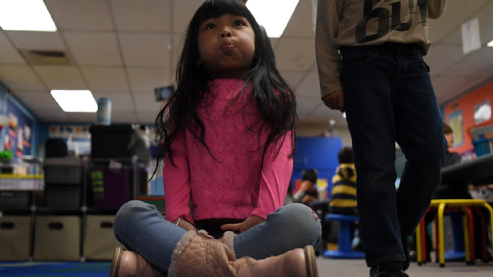 Suri Nguyen, 6, is the first kindergarten student to sit on the carpet with a bubble in her mouth at Lakewood's Westgate Elementary School.