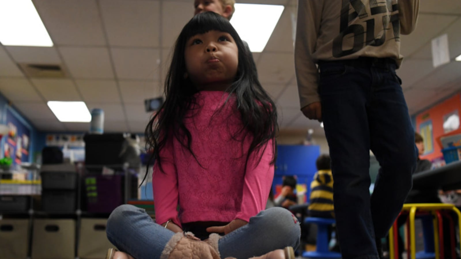 Suri Nguyen, 6, is the first kindergarten student to sit on the carpet with a bubble in her mouth at Lakewood's Westgate Elementary School.