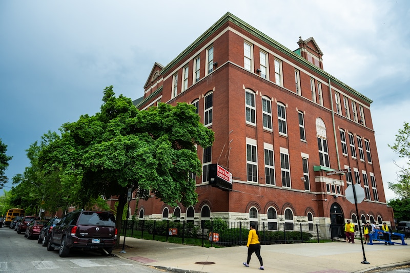 A large red brick school building.