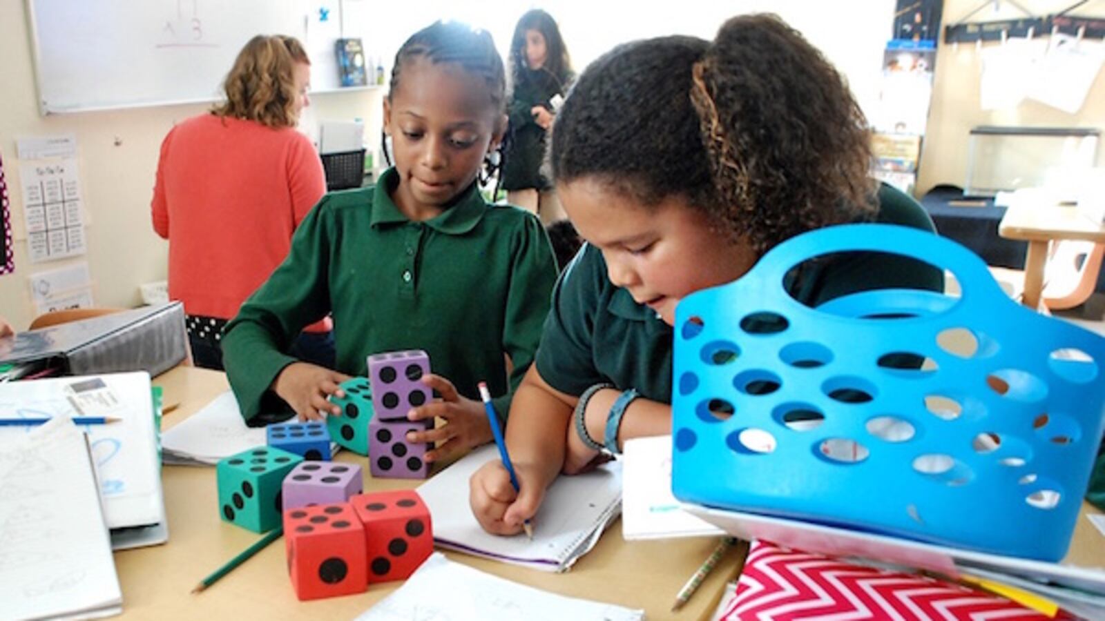 Students at the AXL Academy charter school in Aurora work on math problems in 2015. Photo by Nic Garcia