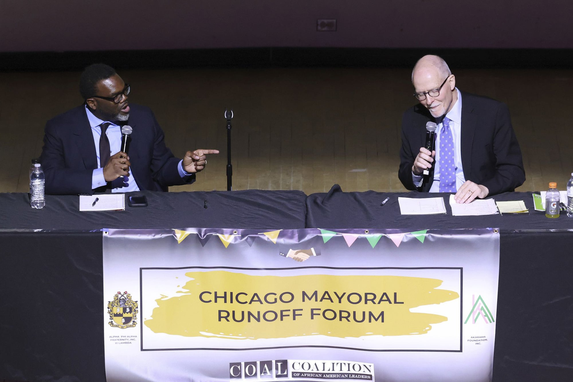 Cook County Commissioner Brandon Johnson (left) and former Chicago Public Schools CEO Paul Vallas (right) are running to be Chicago’s next mayor.
