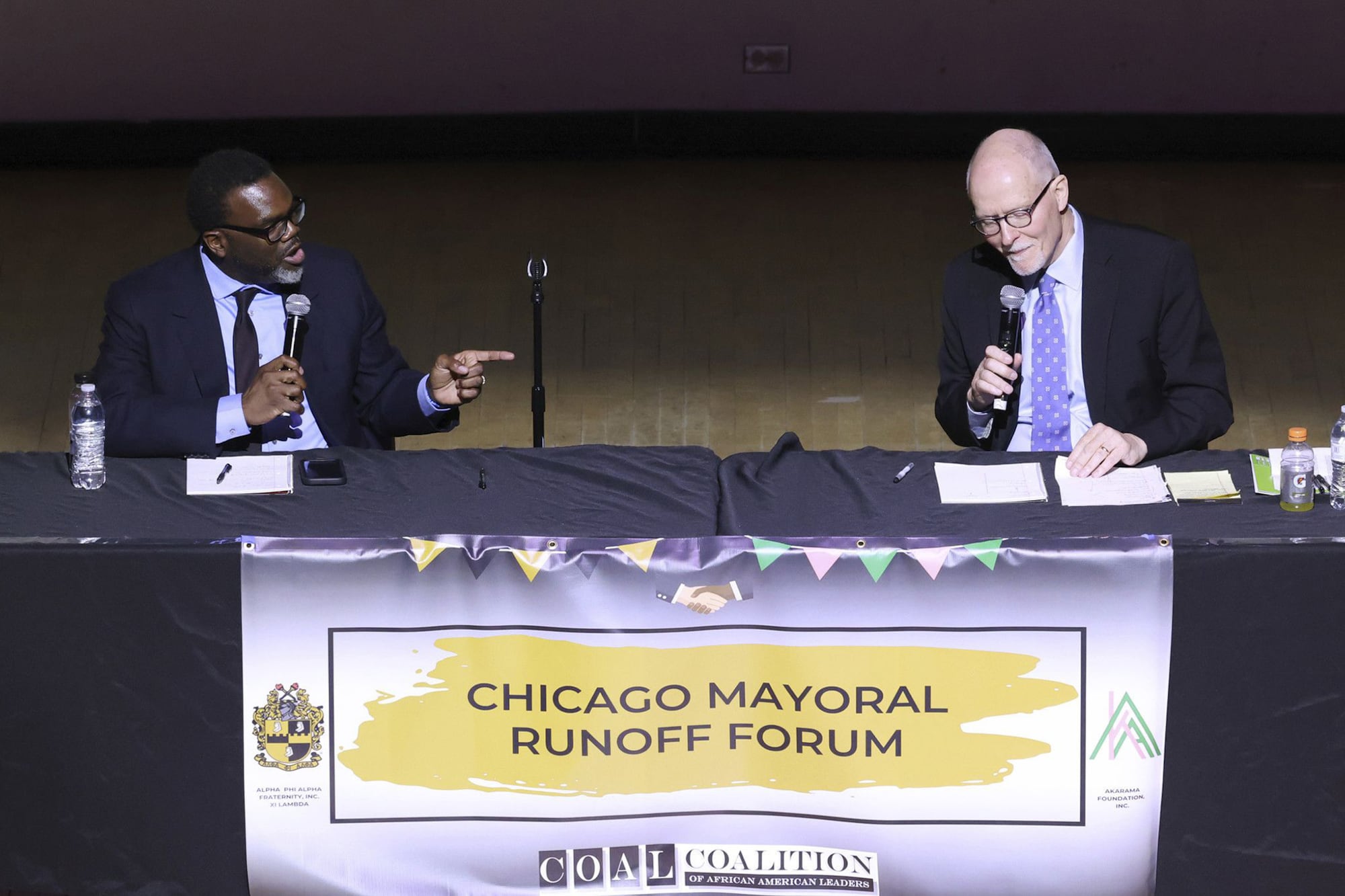 Cook County Commissioner Brandon Johnson (left) and former Chicago Public Schools CEO Paul Vallas (right) are running to be Chicago’s next mayor. 