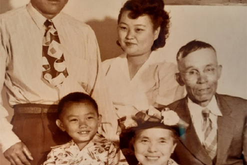 A family photo shows four adults and two children.
