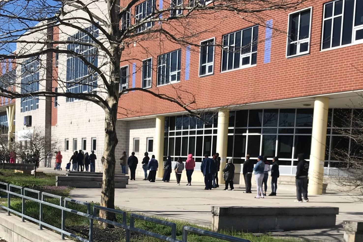 Students line up outside Universal Audenreid to pick up Chromebooks