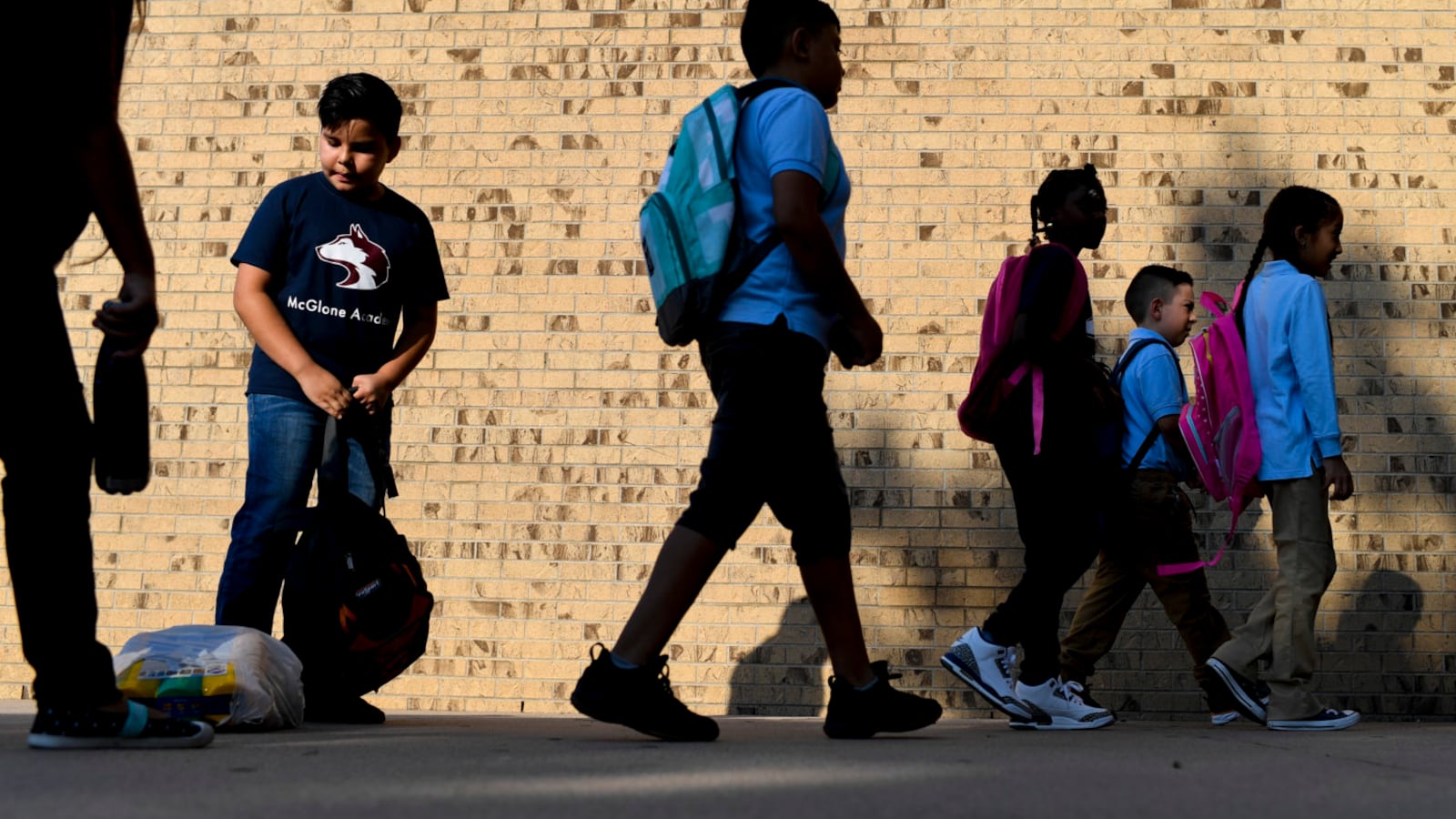 Students enter the building on the first day of school at Denver's McGlone Academy on Wednesday, August 15, 2018. (Photo by AAron Ontiveroz/The Denver Post via Getty Images)
