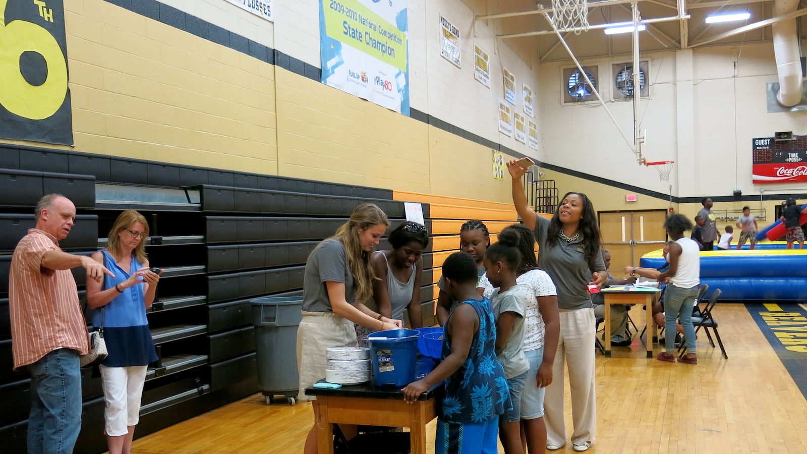 Teachers at Neely's Bend College Prep School help incoming fifth-graders make slime at the new Nashville charter school's open house in August. Teachers from Neely's Bend Middle School, which is being phased out, were also on hand to help.