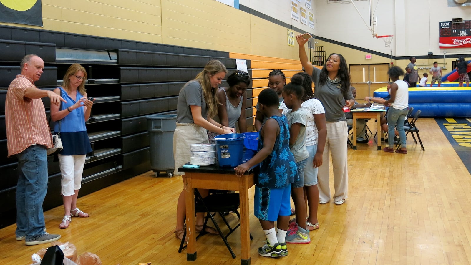 Teachers at Neely's Bend College Prep School help incoming fifth-graders make slime at the new Nashville charter school's open house in August. Teachers from Neely's Bend Middle School, which is being phased out, were also on hand to help.