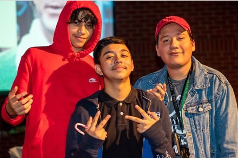 José Ayala (right) joins two of his mentees, José Rameiz (left) and Rene García, stand together at an end-of-the-year party at Streets Ministries in Memphis in 2020.