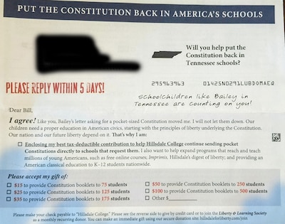 A small mailer with red and black text on it.