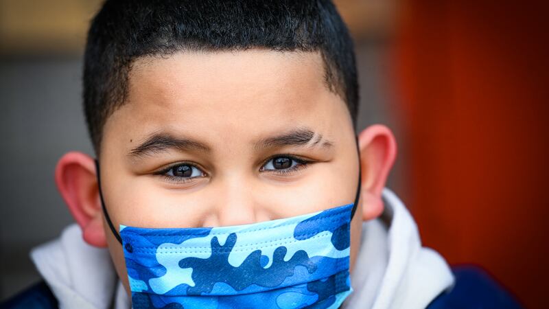 Jariel Acosta, 8, wearing a face mask.
