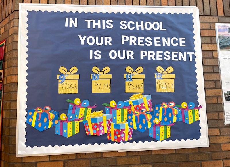 A sign on a brick wall.