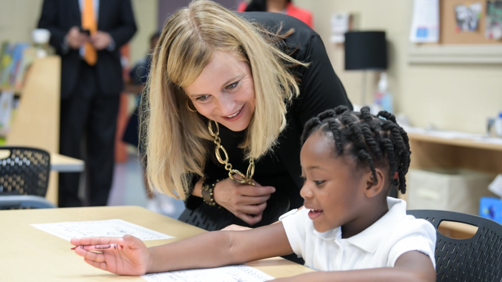 Nashville Mayor Megan Barry visits with a student at Buena Vista Elementary School on Monday, her first day back to work after the death of her only son to a drug overdose.