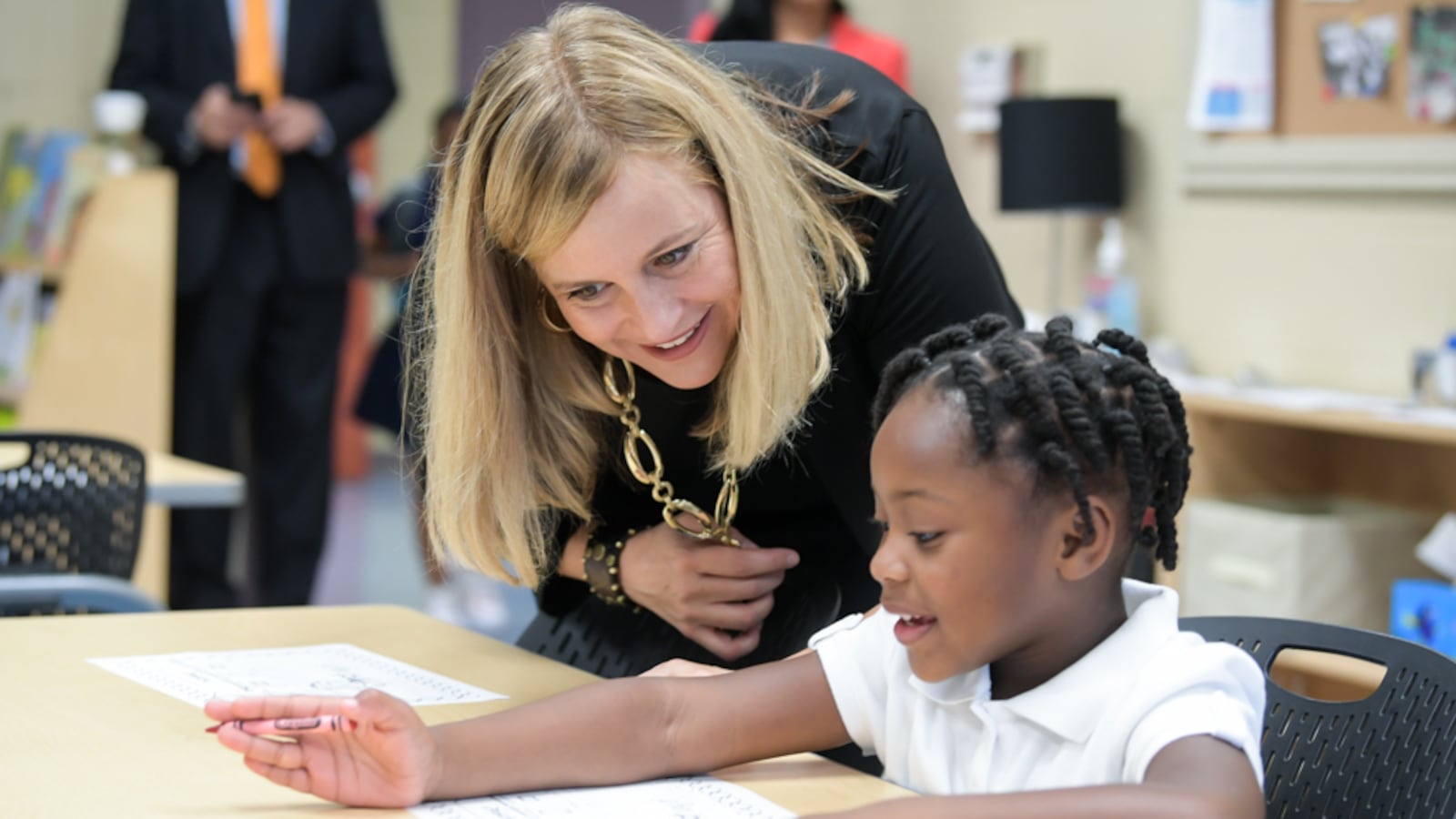 Nashville Mayor Megan Barry visits with a student at Buena Vista Elementary School on Monday, her first day back to work after the death of her only son to a drug overdose.