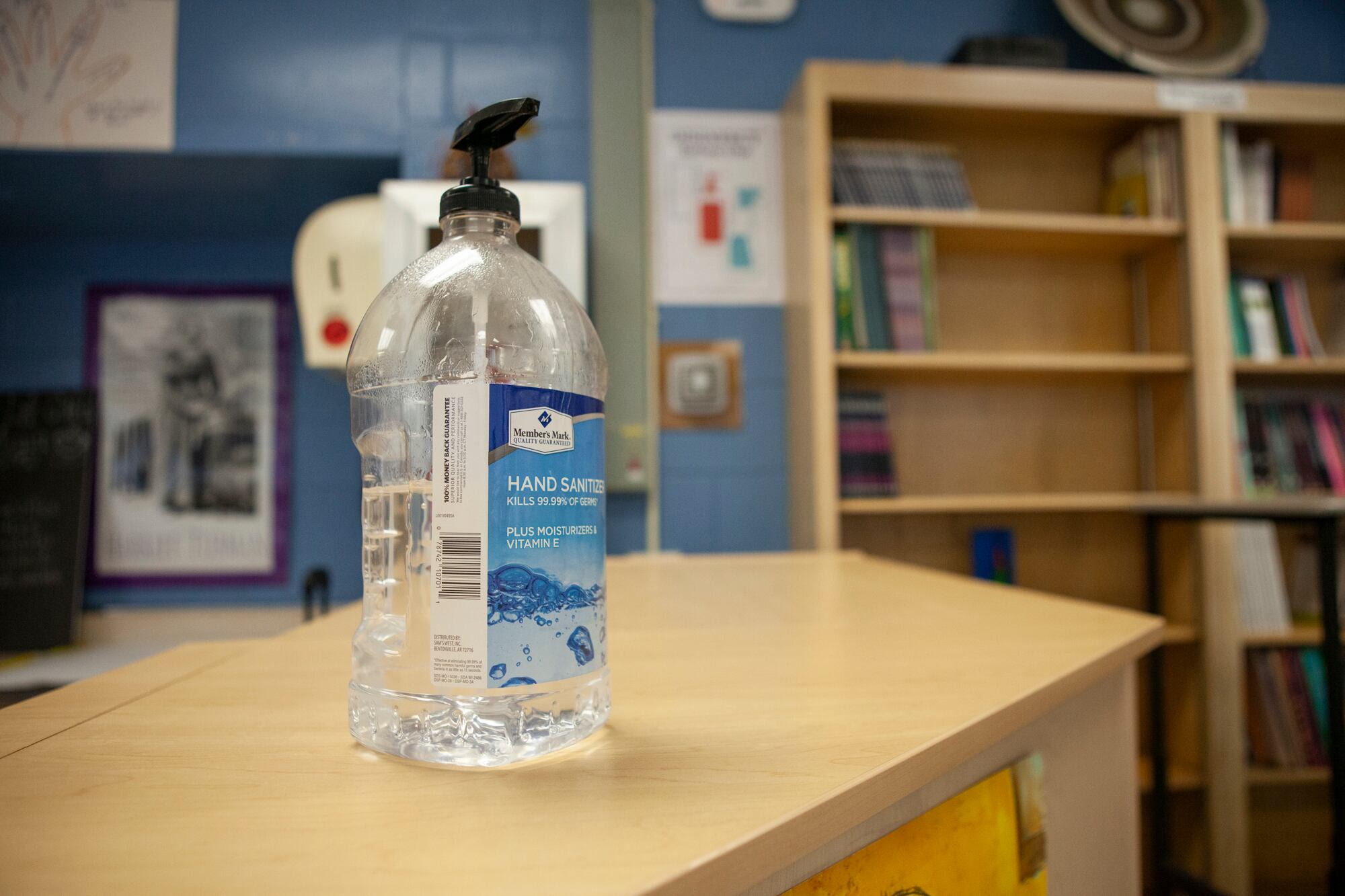 A bottle of hand sanitizer in a library.