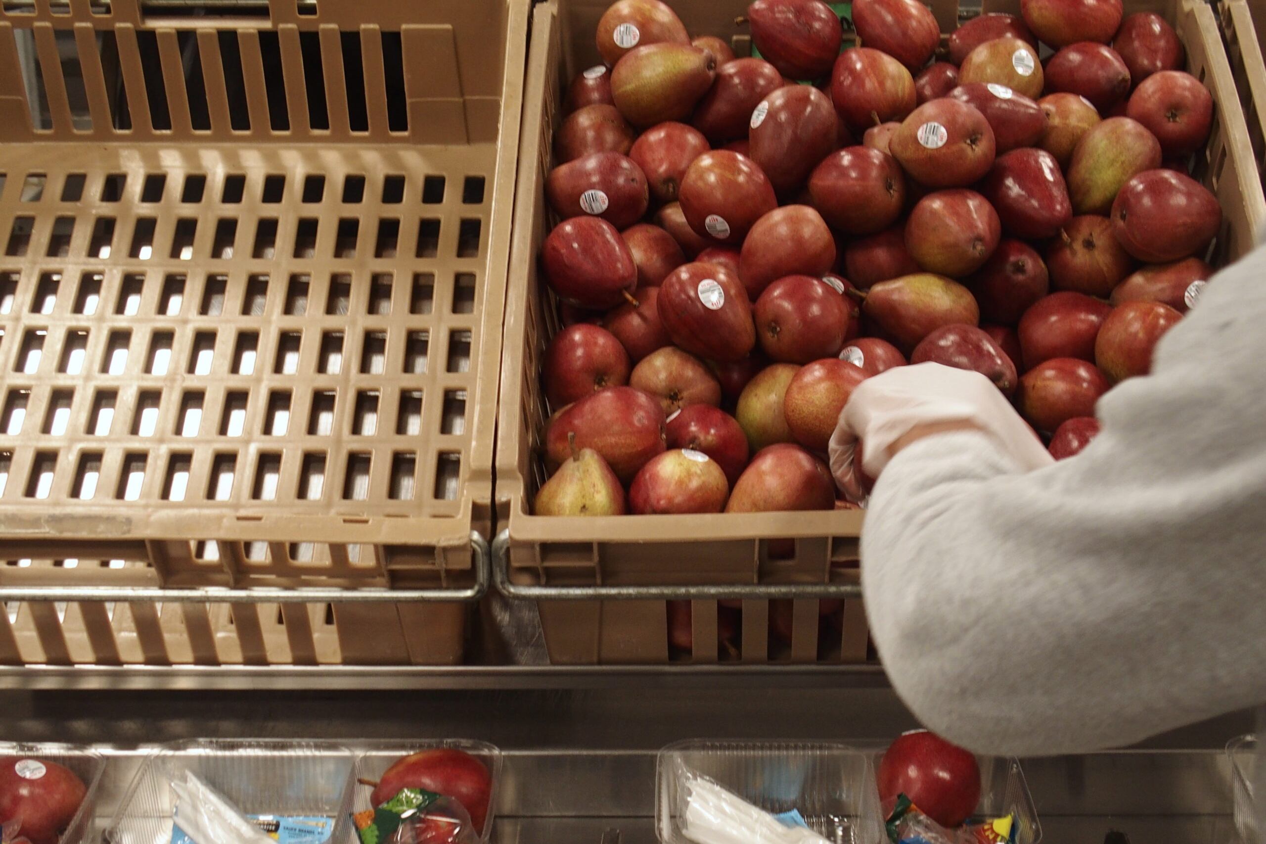 Shelby County Schools staff prepare to-go lunches for students while school is closed over concerns of the new coronavirus spreading. The district is no longer handling the meal distribution after a nutrition services employee tested positive for COVID-19.
