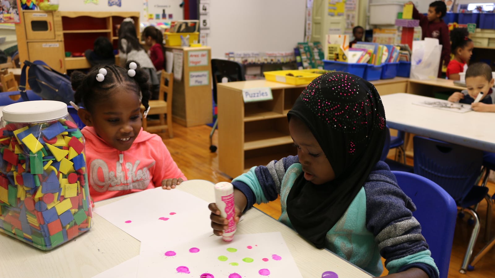 Pre-K students at P.S. 277 in the Bronx play with paint during center time. The education department announced a record number of families received an offer for their top-choice Pre-K for All program, but there were fewer applications overall.