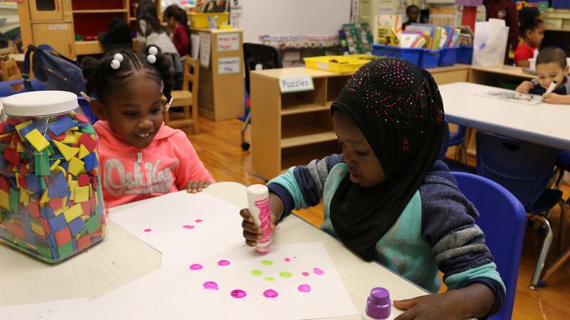 Pre-K students at P.S. 277 in the Bronx play with paint during center time. The education department announced a record number of families received an offer for their top-choice Pre-K for All program, but there were fewer applications overall.