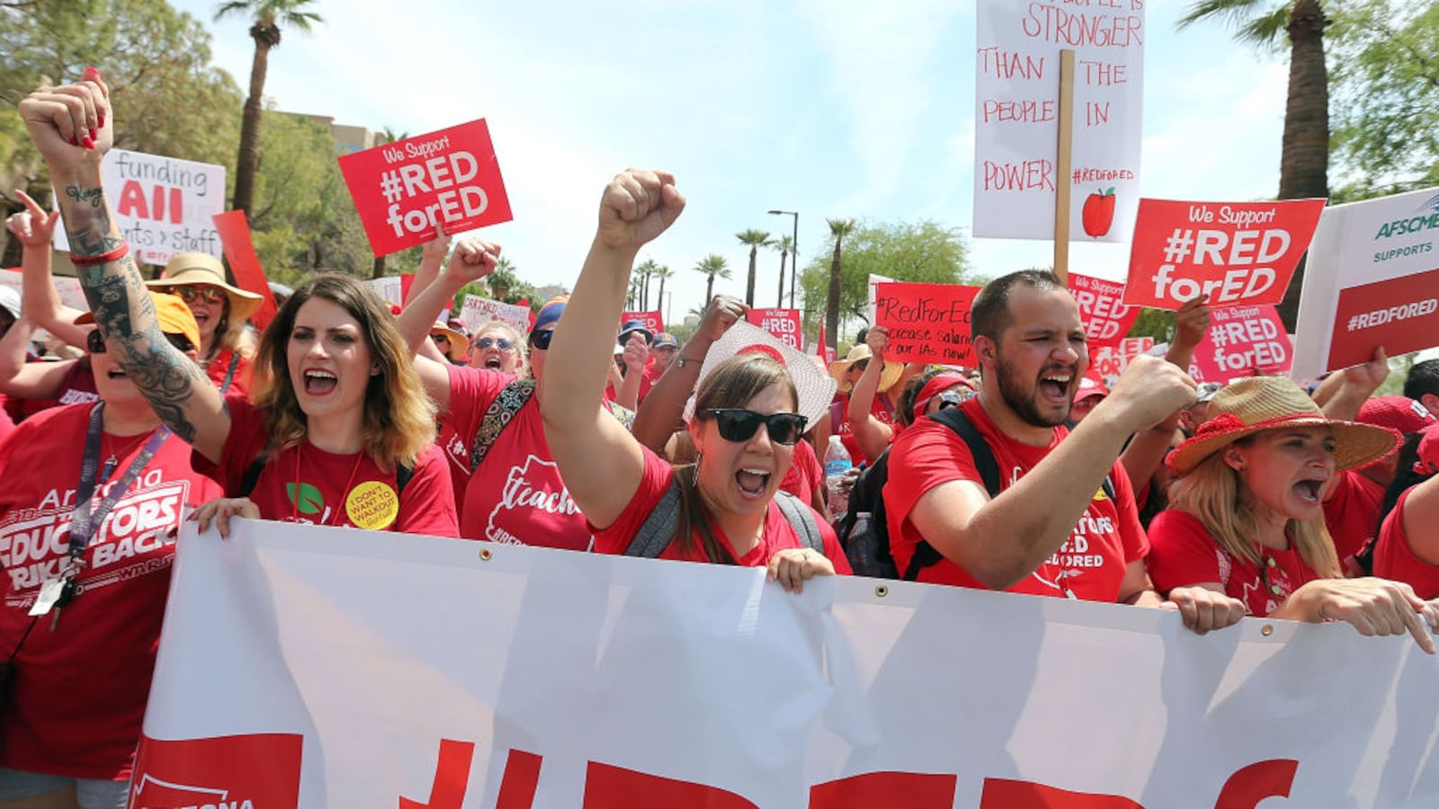Arizona teachers chant in support of the #REDforED movement as they walk through downtown Phoenix to the State Capitol on April 26, 2018. The walkout sought better wages and state funding for public schools. Its leaders are talking with teachers in Tennessee about how they can organize in a similar fashion. (Photo by Ralph Freso/Getty Images)