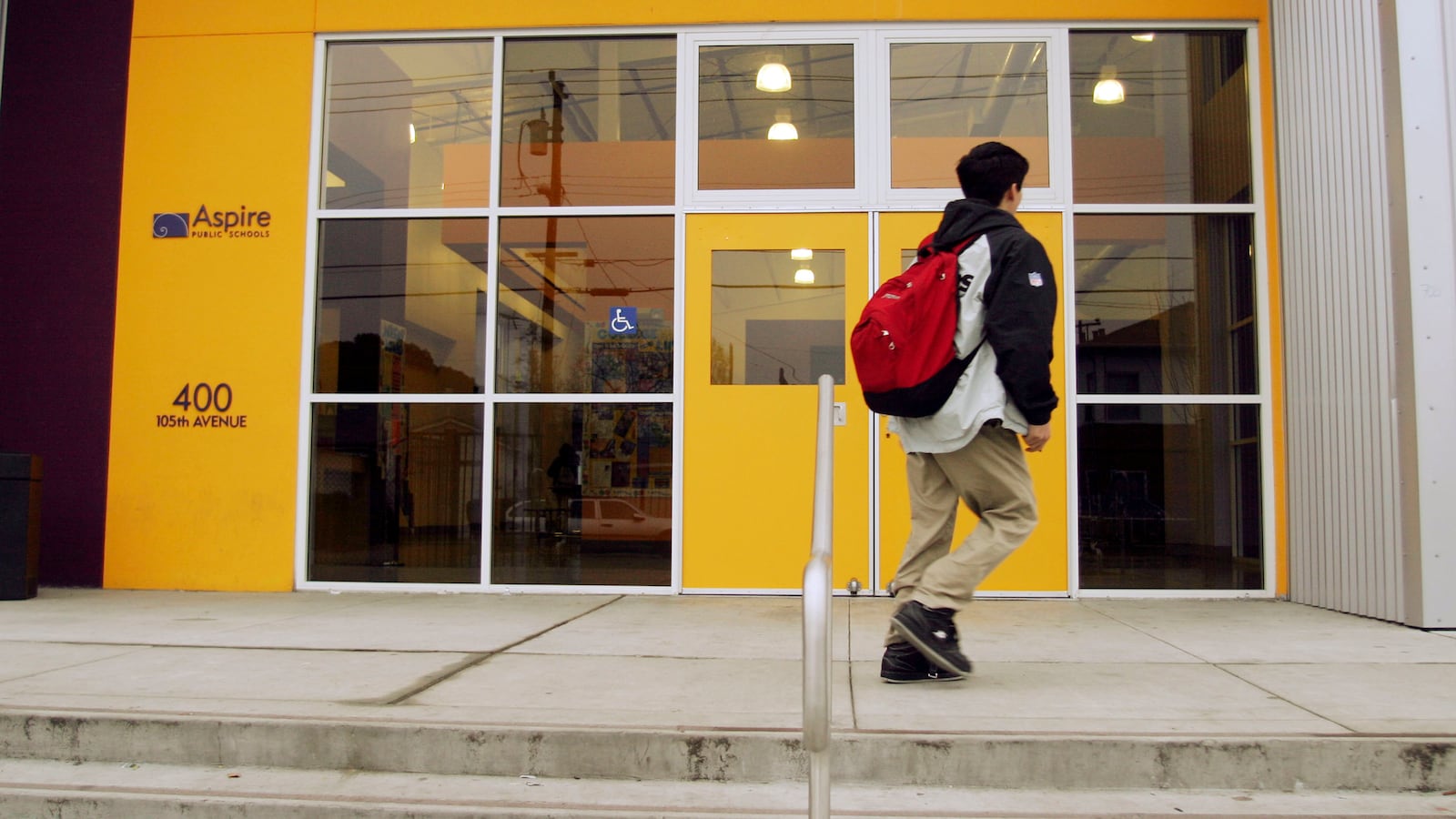 A student arrives for classes at the Lionel Wilson College Preparatory Academy, an Aspire charter school, located in the Oakland Unified School District. (Photo by Kim Kulish/Corbis via Getty Images)