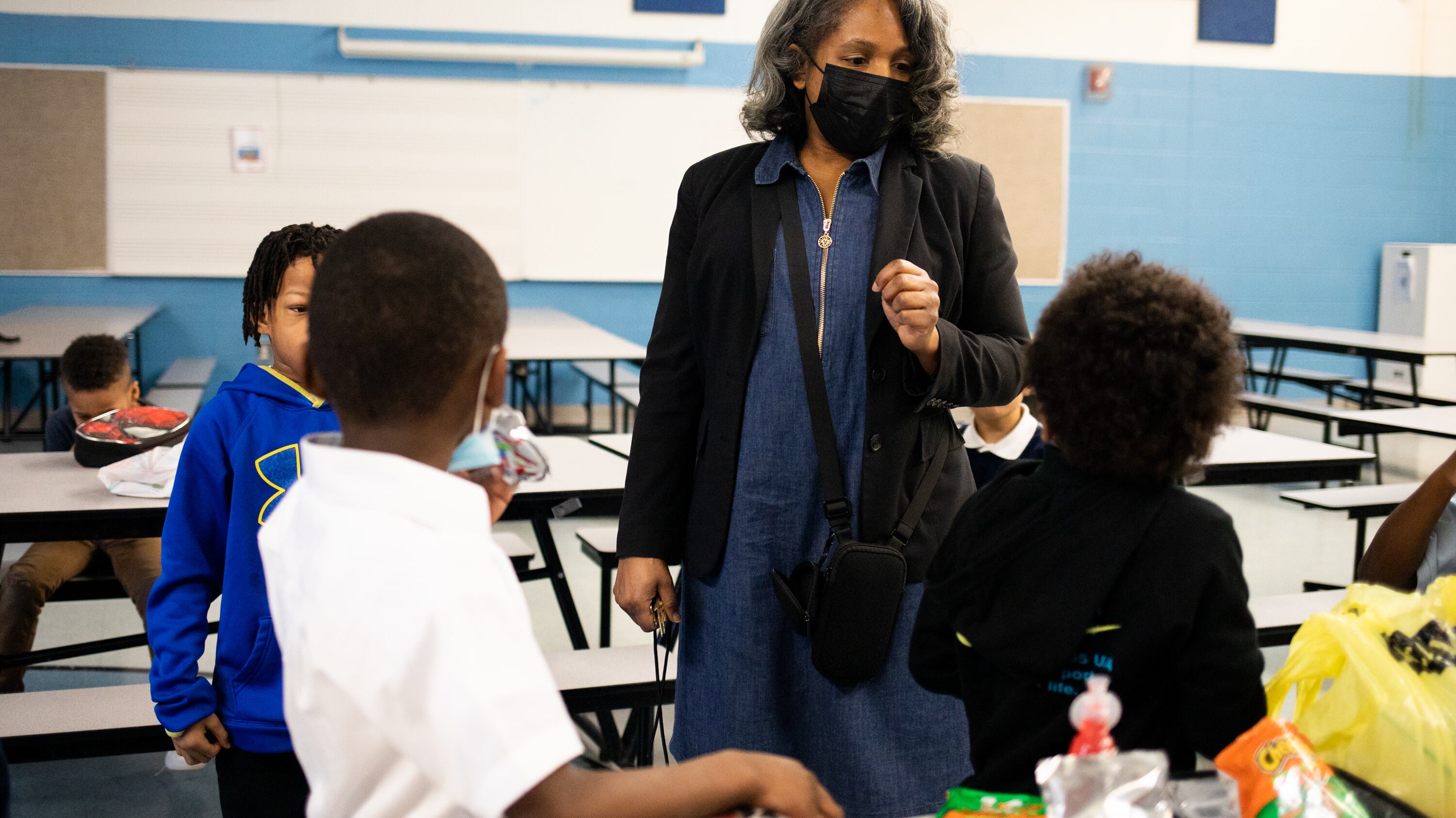 A woman is talking to a group of students in a Detroit classroom.