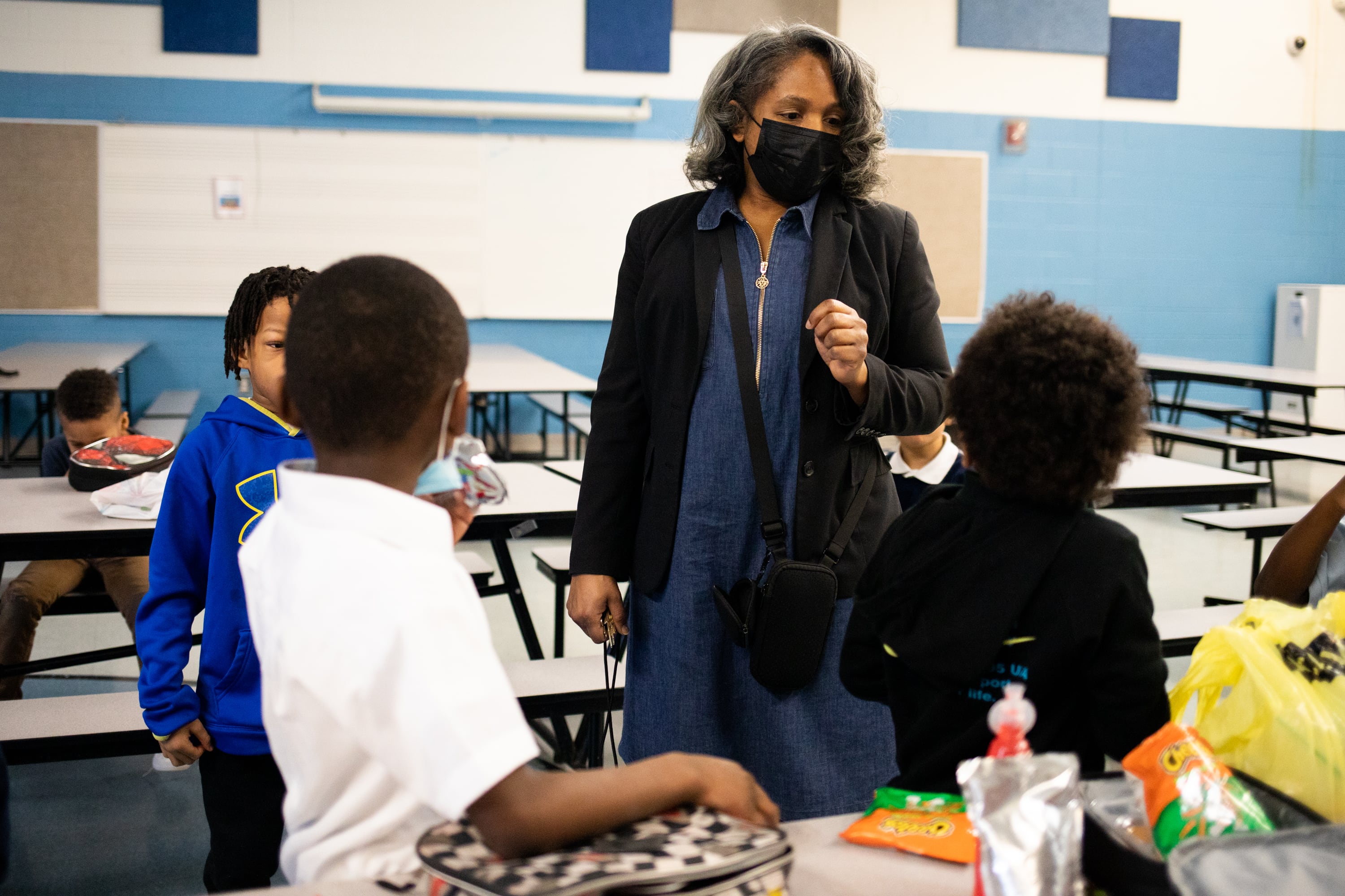 A woman is talking to a group of students in a Detroit classroom.