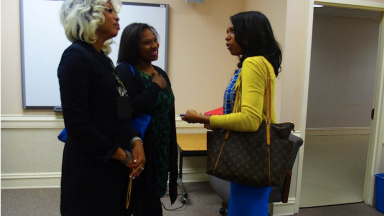 From left: Sharon Griffin, regional superintendent of the Innovation Zone in Memphis, speaks with iZone adviser Ashleigh Dennis and Kameelah Shaheed-Diallo, a vice president with The Mind Trust, a nonprofit education organization based in Indianapolis.