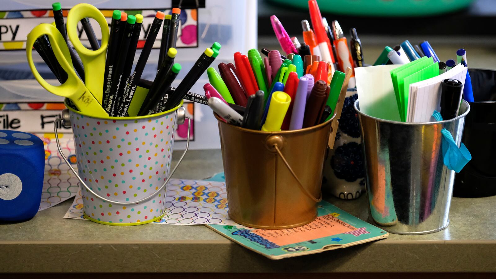 Containers hold markers and scissors in a classroom at Thomas Gregg Neighborhood School, an elementary school in Indianapolis, Indiana. —April, 2019— Photo by Alan Petersime/Chalkbeat