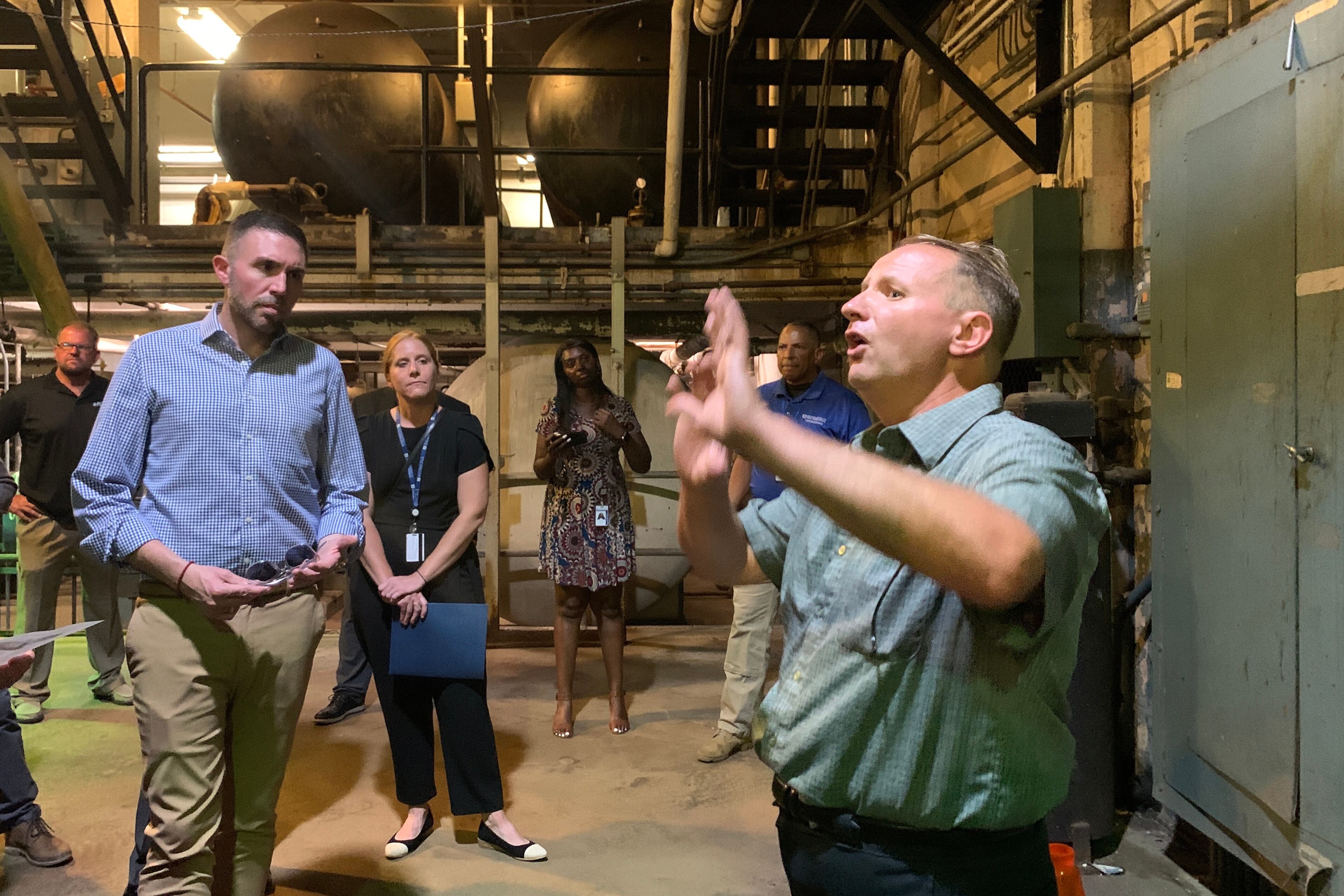 District facilities director Jeff Scott explains the intricacies of South Philly High School’s electrical and heating infrastructure on Monday July 31, 2023 in Philadelphia.