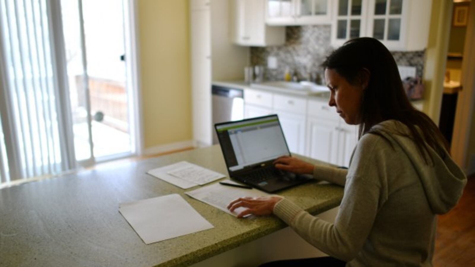 Erin Reiner grades her students’ projects at her home in Lakewood on Thursday, March 26, 2020.