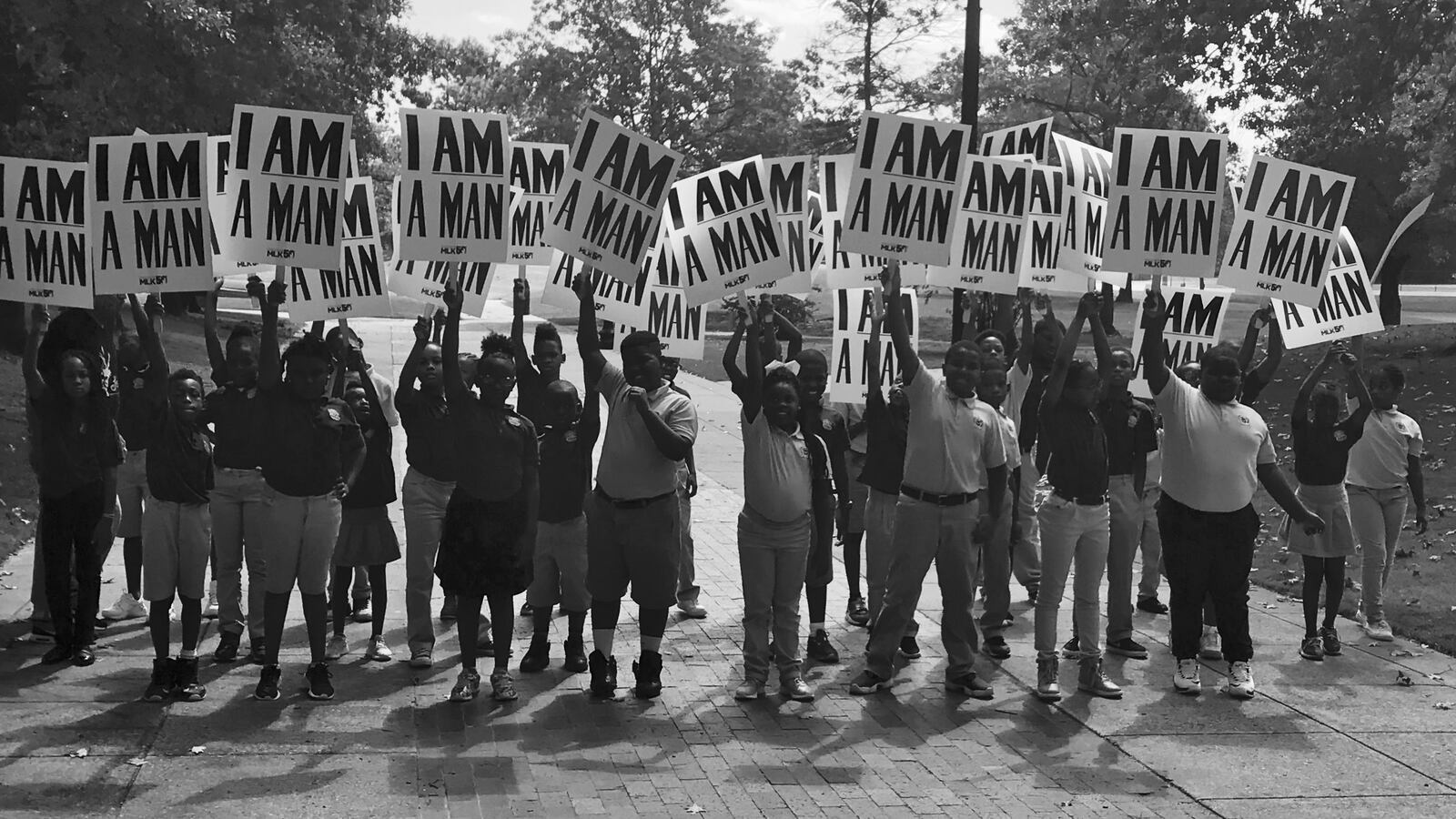 Third- and fourth-graders at Vision Preparatory Charter School re-enact Ernest C. Withers’ famous photograph of striking Memphis sanitation workers in 1968.