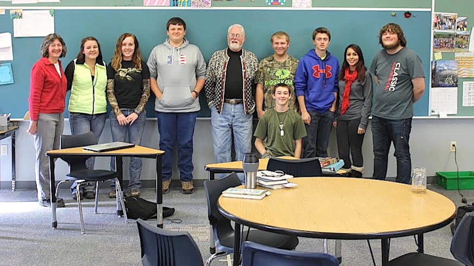 Teacher Denise Perritt (far left) poses with her high school English students and a guest speaker who visited her class, author Robert Fulghum.