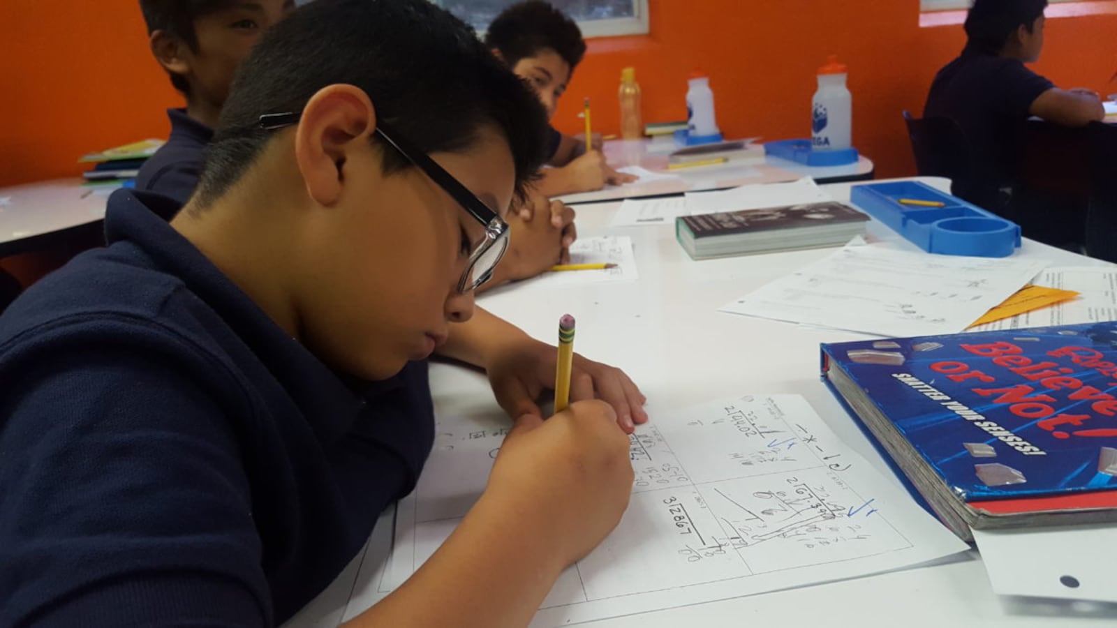 Sixth grade students work on math problems during a September 2018 class at Vega Collegiate Academy in Aurora.