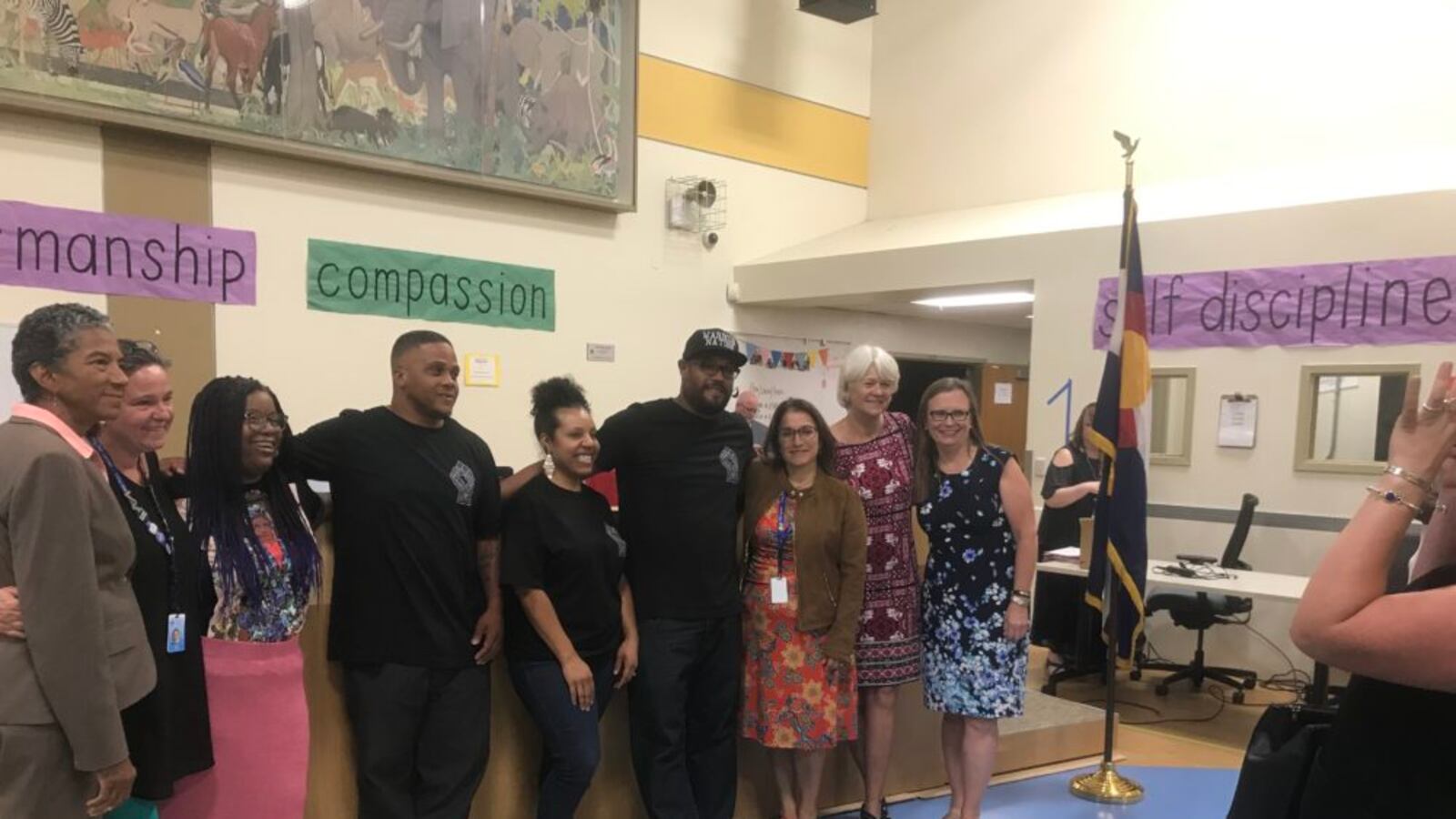 The founders of the proposed Michelle Obama STEAM Academy pose with school board members and Superintendent Susana Cordova.