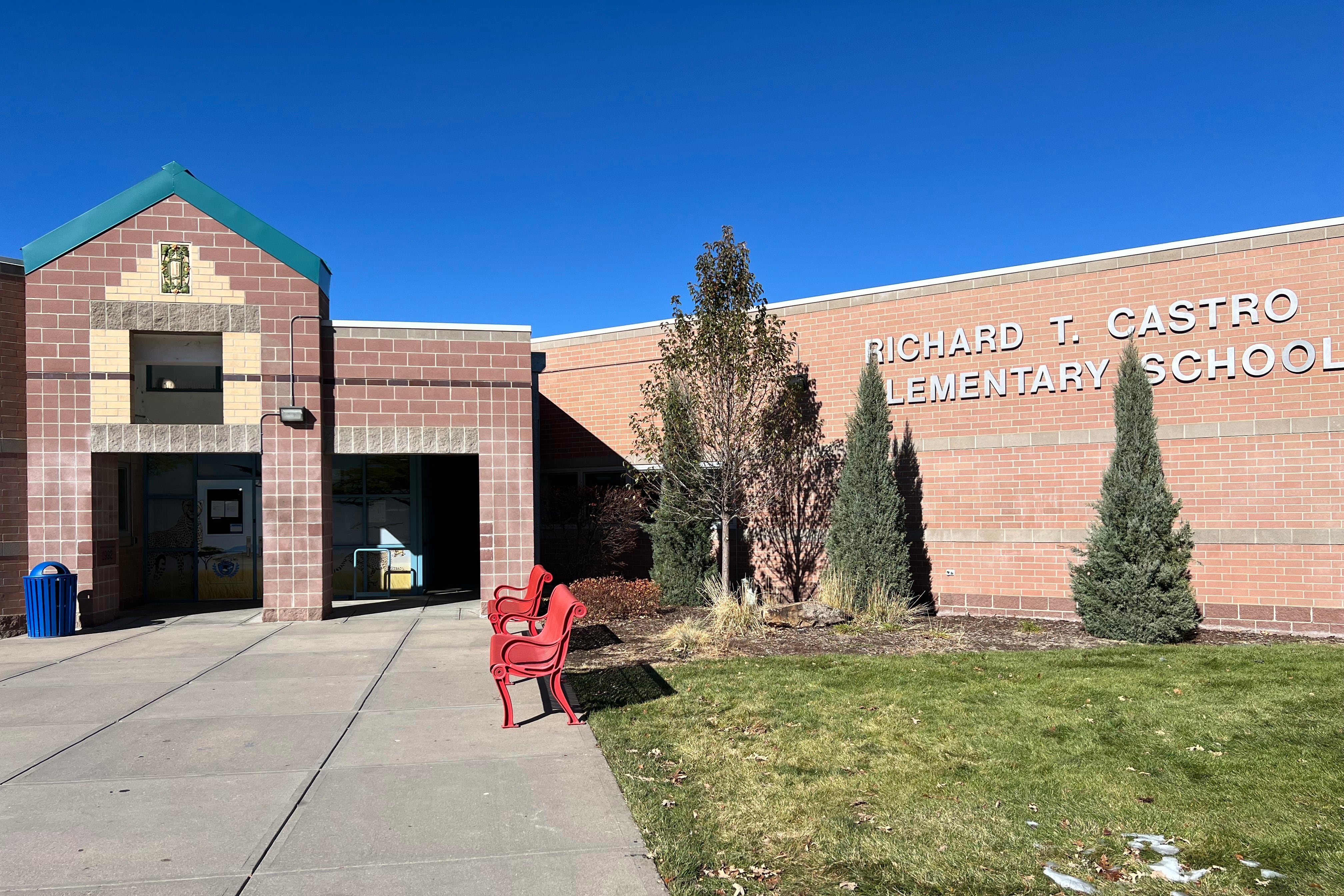 The front entrance to a brick school building.