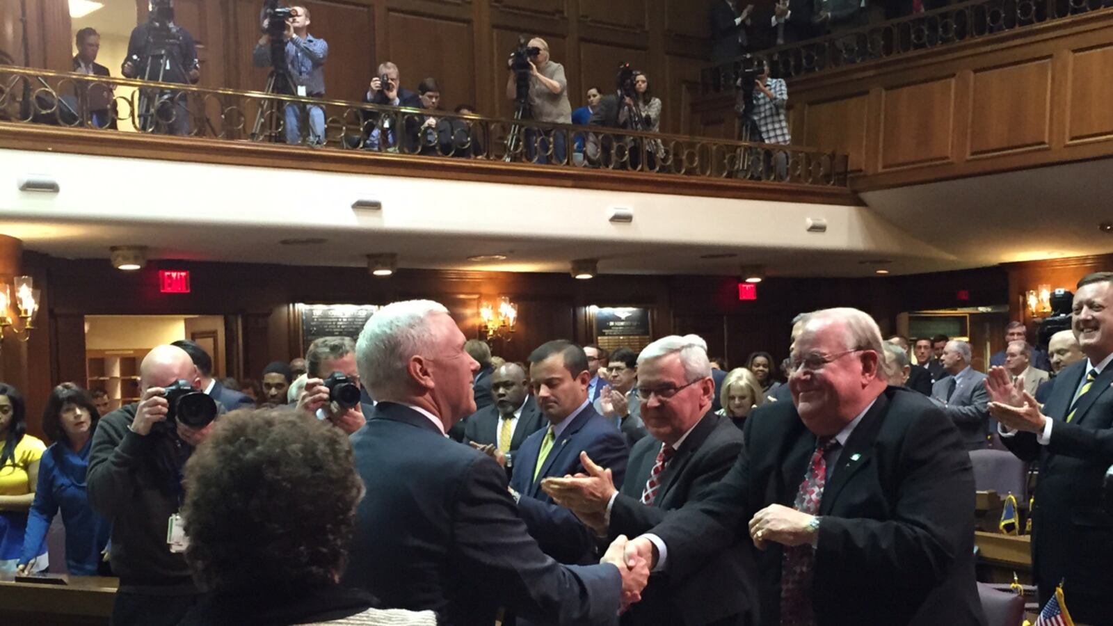Gov. Mike Pence greets Republican lawmakers after his State of the State address Tuesday night.