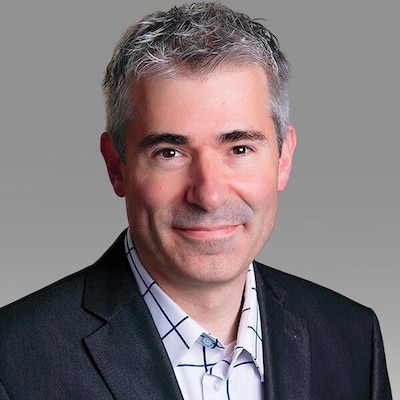 A white male in a suit.