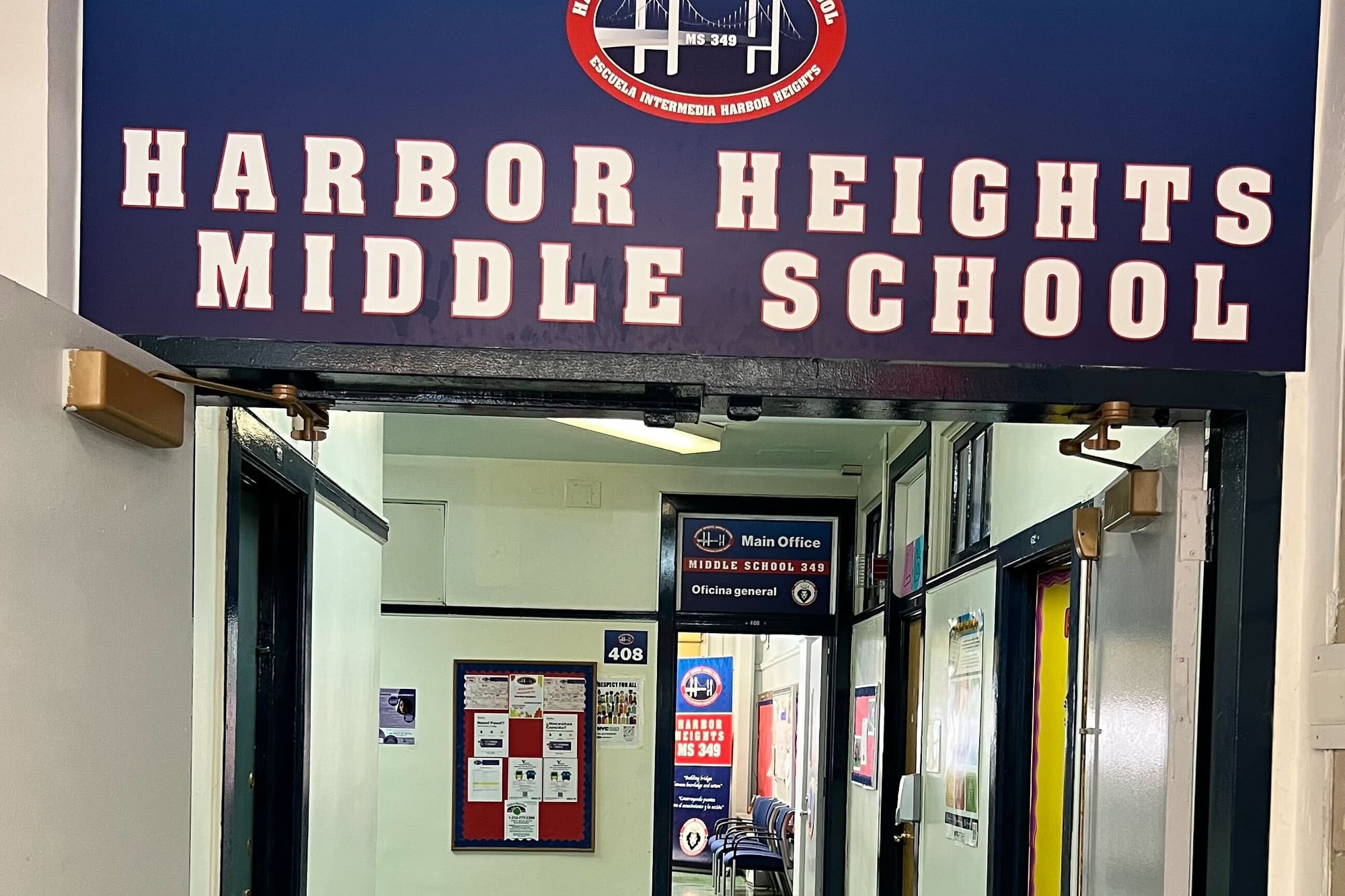 A Harbor Heights middle school sign above a green tile floor.
