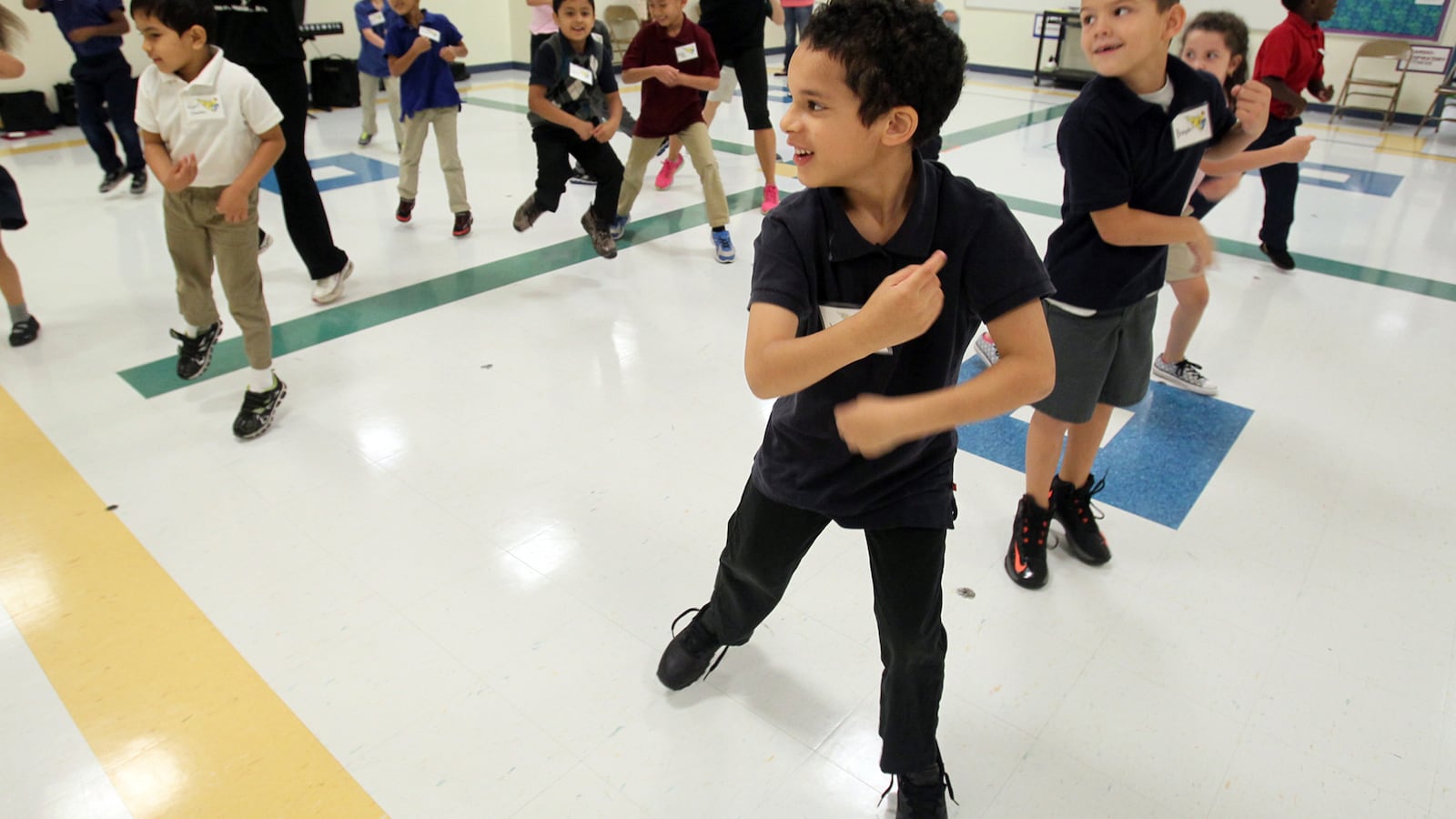 Third-grader Justin Willis, 7, center, dances with his classmates during an educational outreach program. (Mike Cardew/Akron Beacon Journal/TNS via Getty Images)