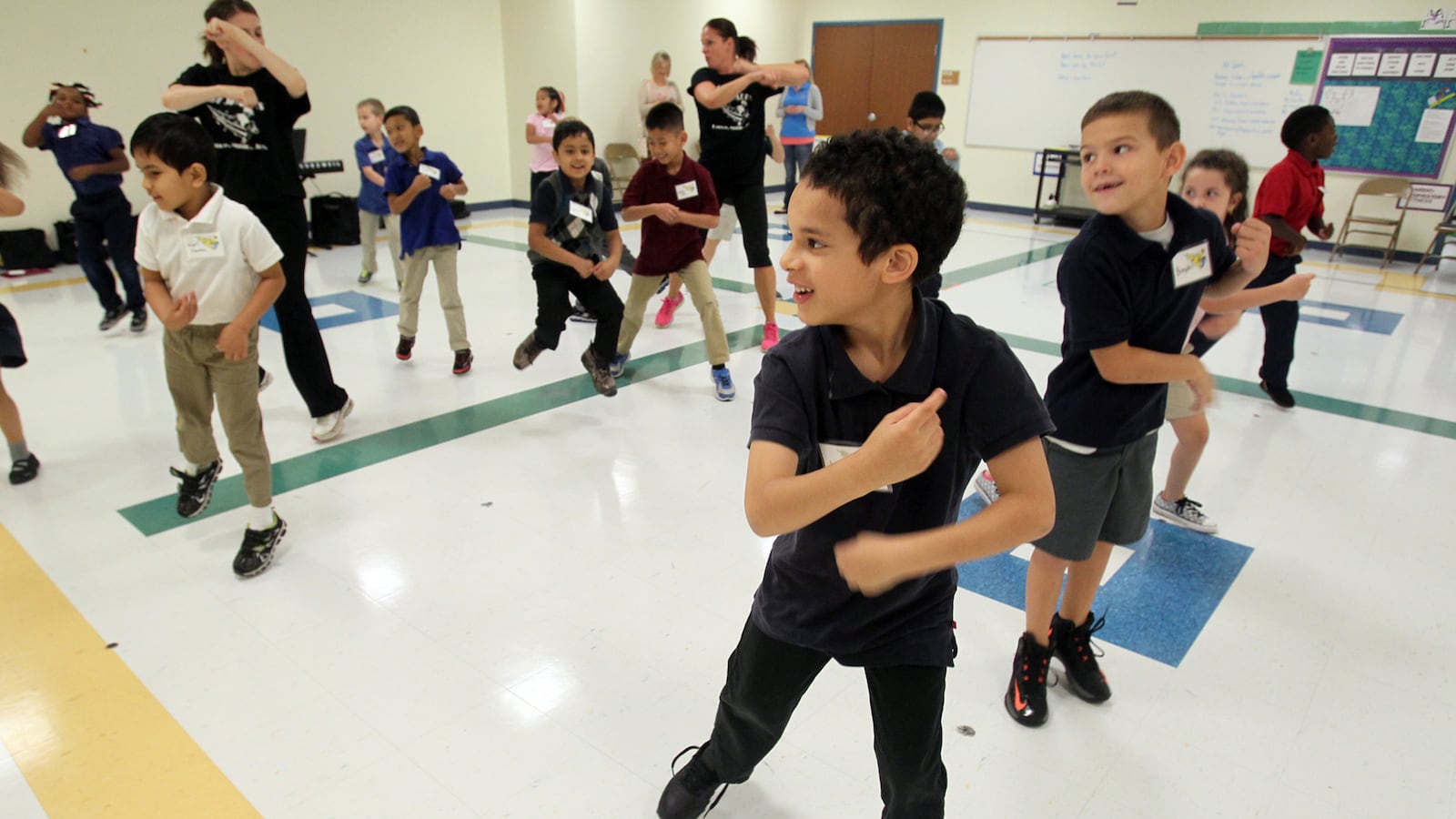 Third-grader Justin Willis, 7, center, dances with his classmates during an educational outreach program. (Mike Cardew/Akron Beacon Journal/TNS via Getty Images)